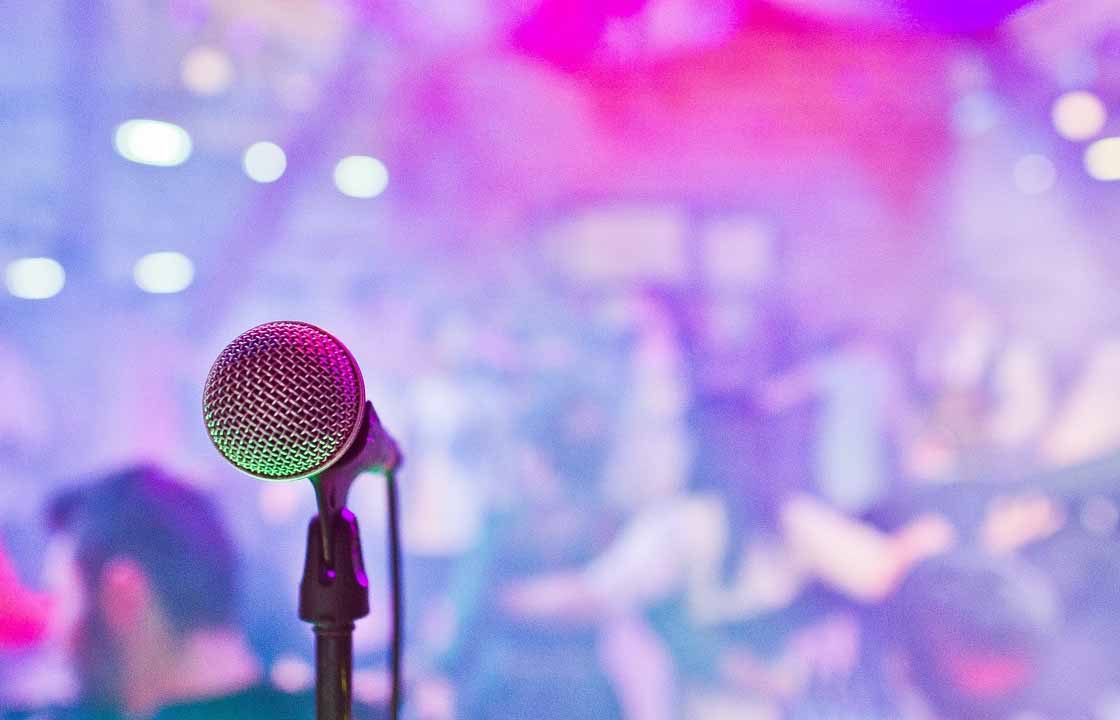 Close-up photo of a microphone in the night club.